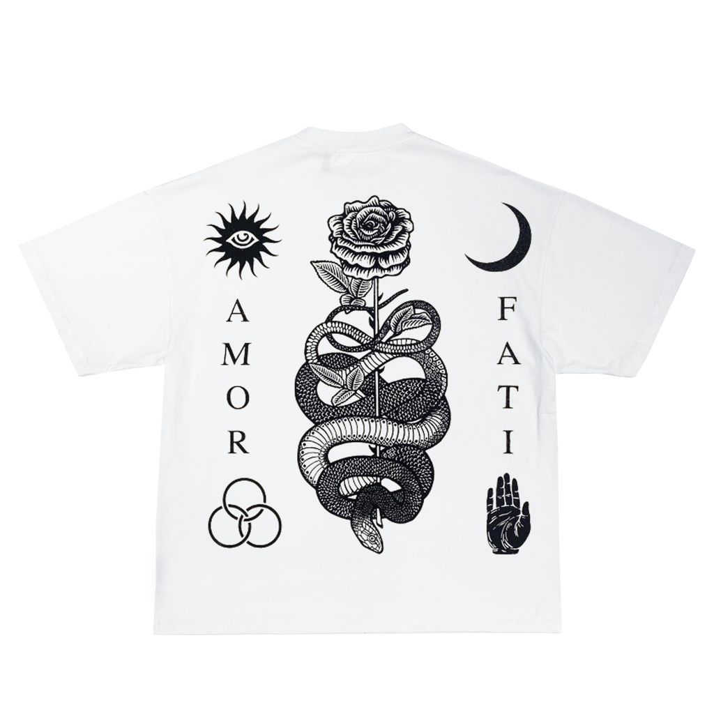 White short-sleeve T-shirt with black graphic prints on the front, including a central snake wrapped around a rose, a sun with an eye, a crescent moon, a hand, and vertical text reading AMOR and FATI.